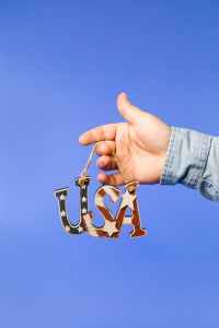 a person holding a usa ornament